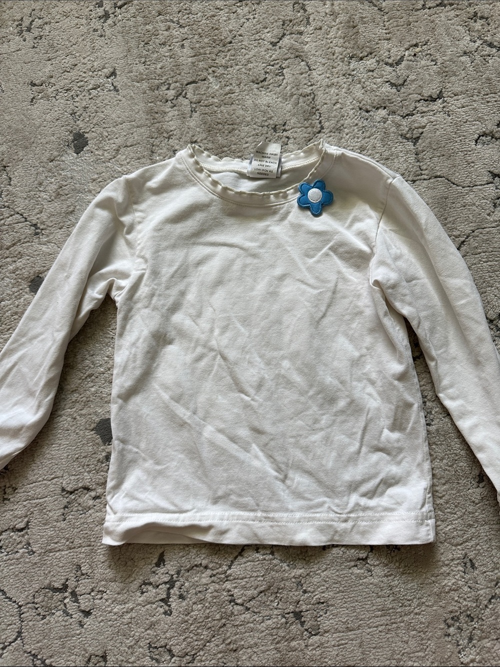 White Long-Sleeve Kids Top with Blue Flower‎ Accent